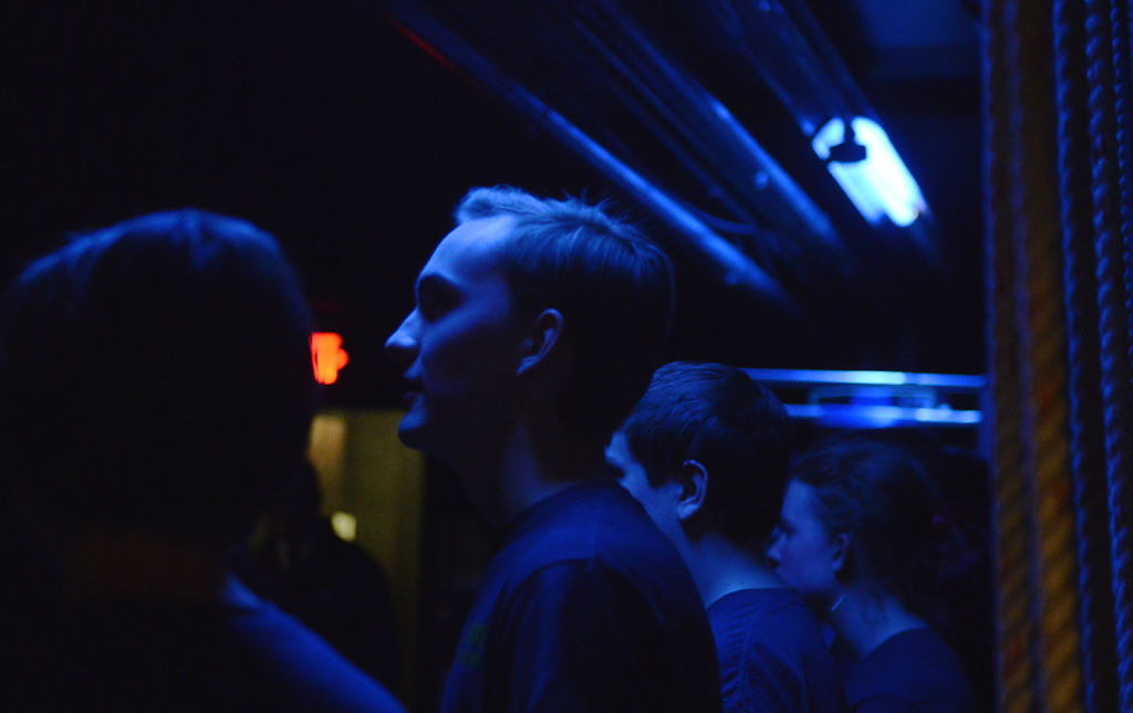 Trombone players from Hickman High School wait backstage